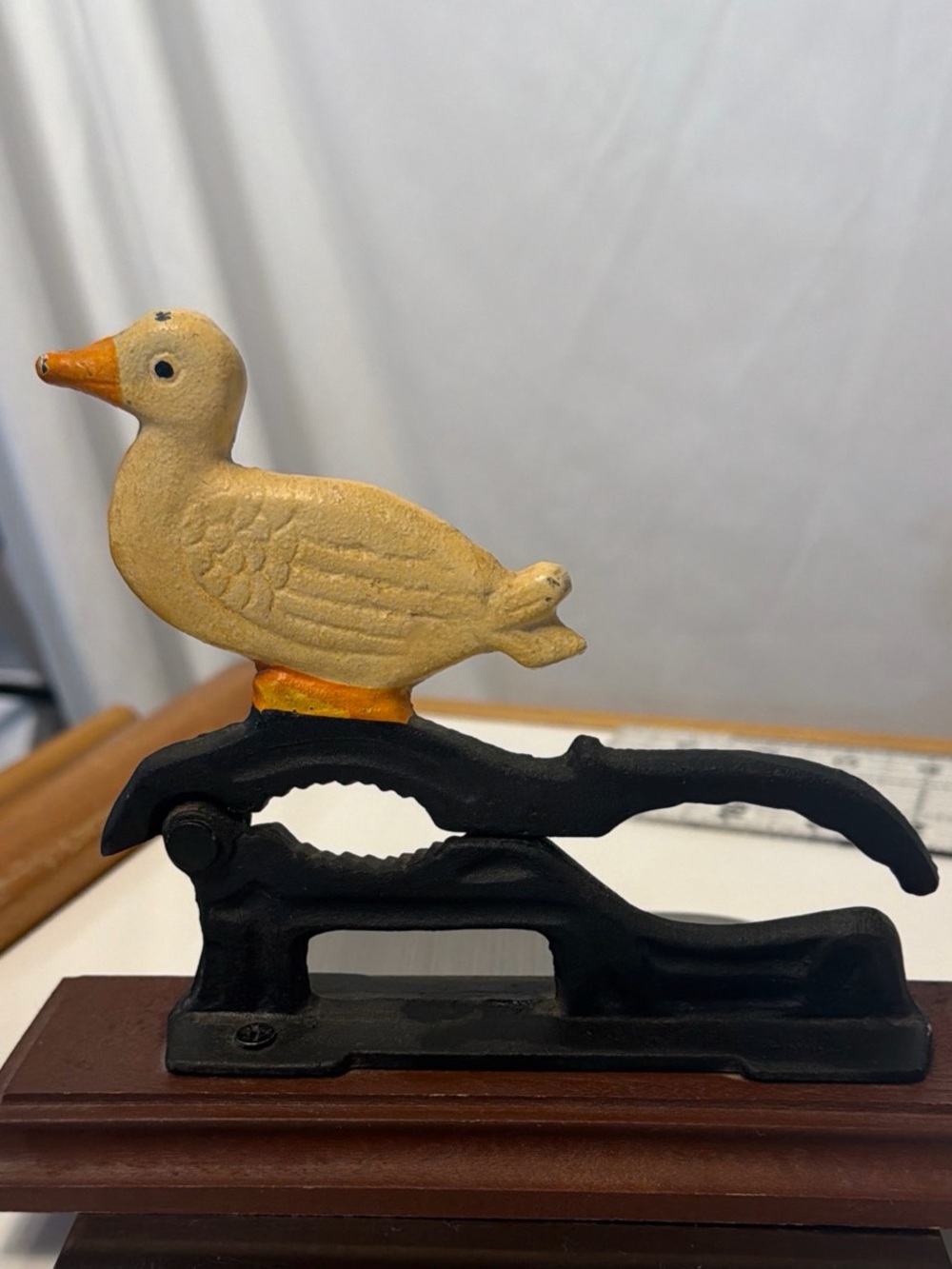Vintage cast iron Decorative Yellow Duck Bird Figurine nut cracker - wooden stan